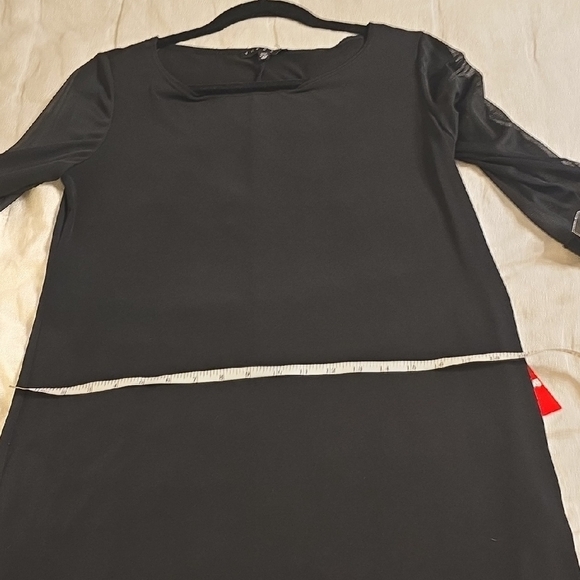 Tiana B. Elegant Black Dress with Embellished Cuffs - Picture 9 of 15